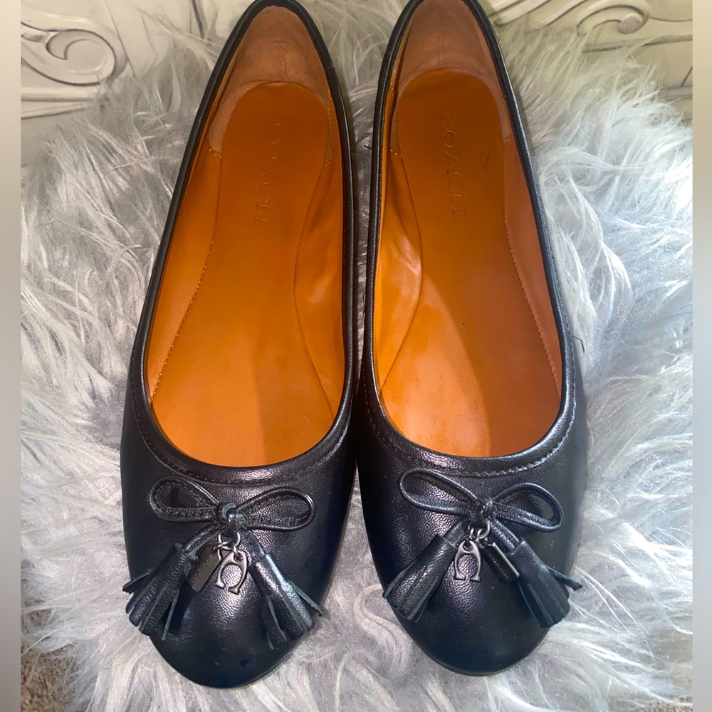Black leather coach flats